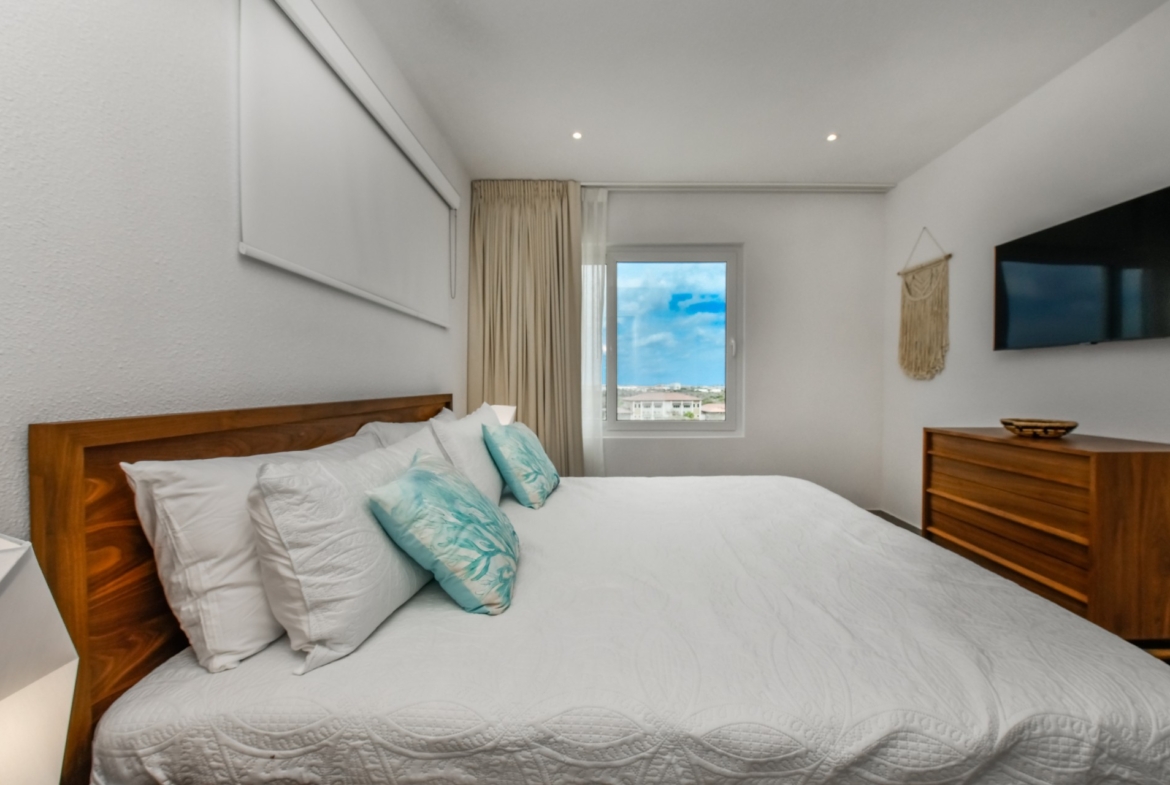 cozy modern bedroom at Commandeurs in Aruba For Sale