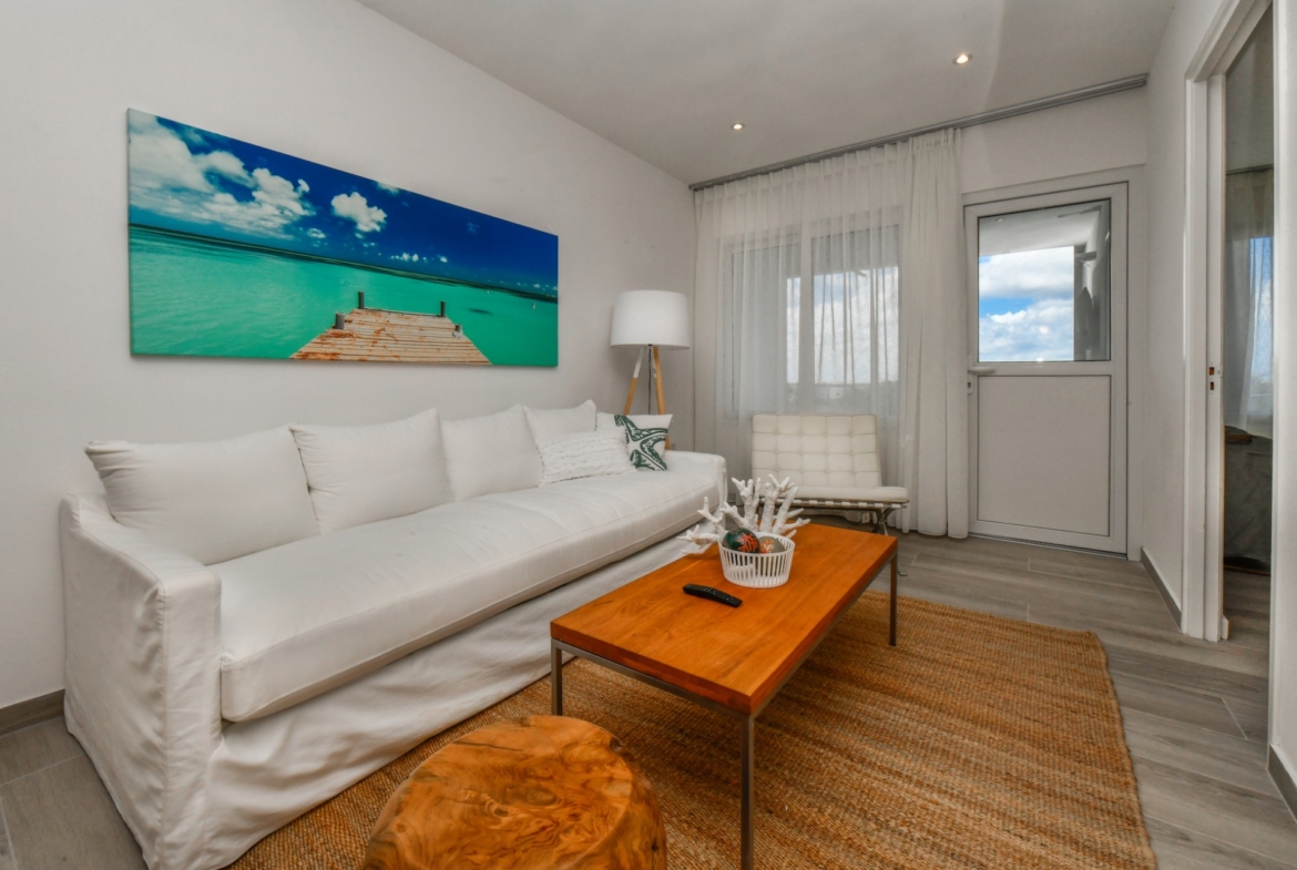 cozy living room at Commandeurs Unit 7 in Aruba For Sale